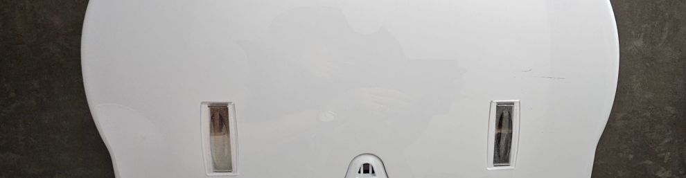 Picture of a loo roll dispenser that looks like a fat faced duck