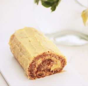 Picture of whole meal looking swiss roll filled with yellow icing.